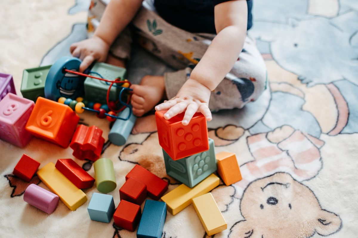 Happy children engaged in activities at Tiny Toddlers Academy in Florissant, MO